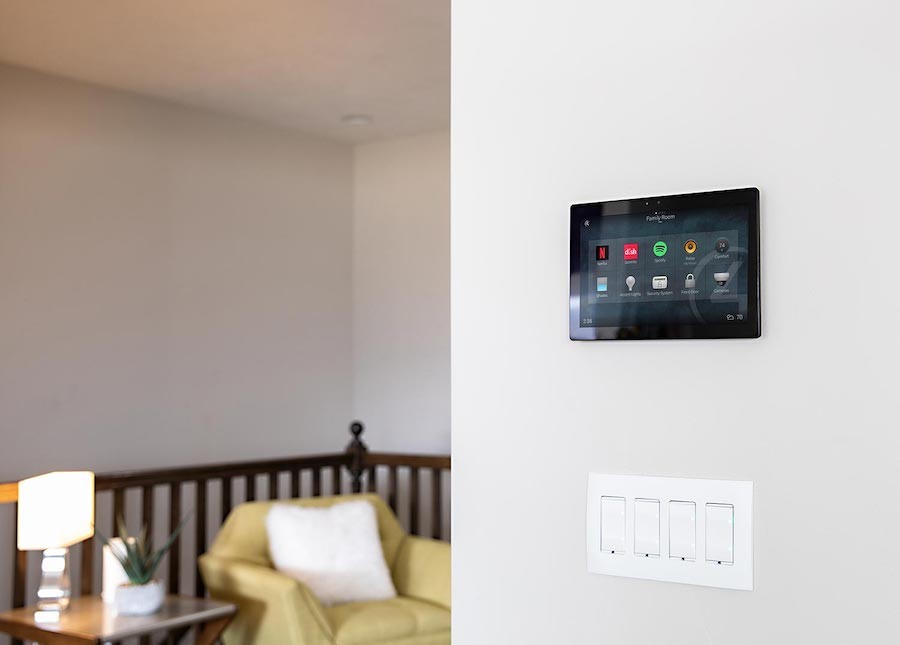 wall-mounted ipad with a Control4 smart home automation touchscreen interface.