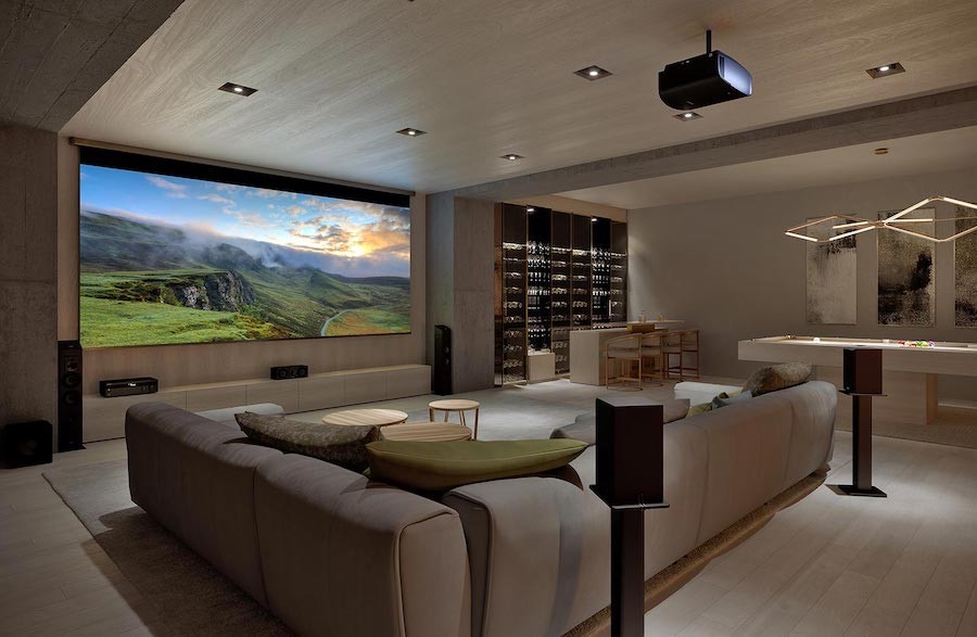high-end luxury home theater with Sony projector, projection screen, and surround sound speakers.