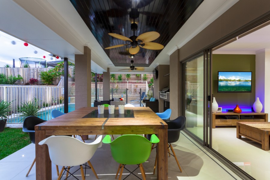  A dining room with a wooden table and chairs to create a warm and inviting atmosphere.