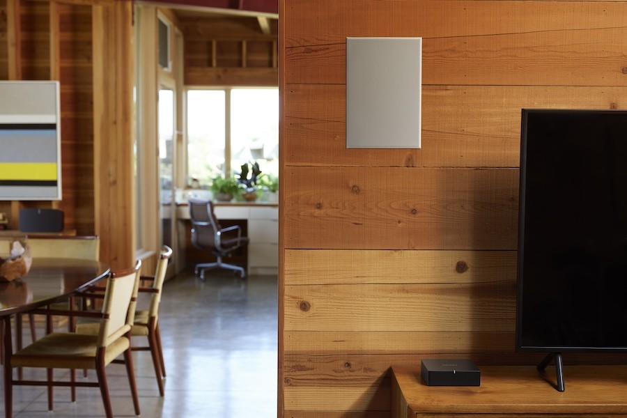 A Sonos speaker installed in a living room wall.